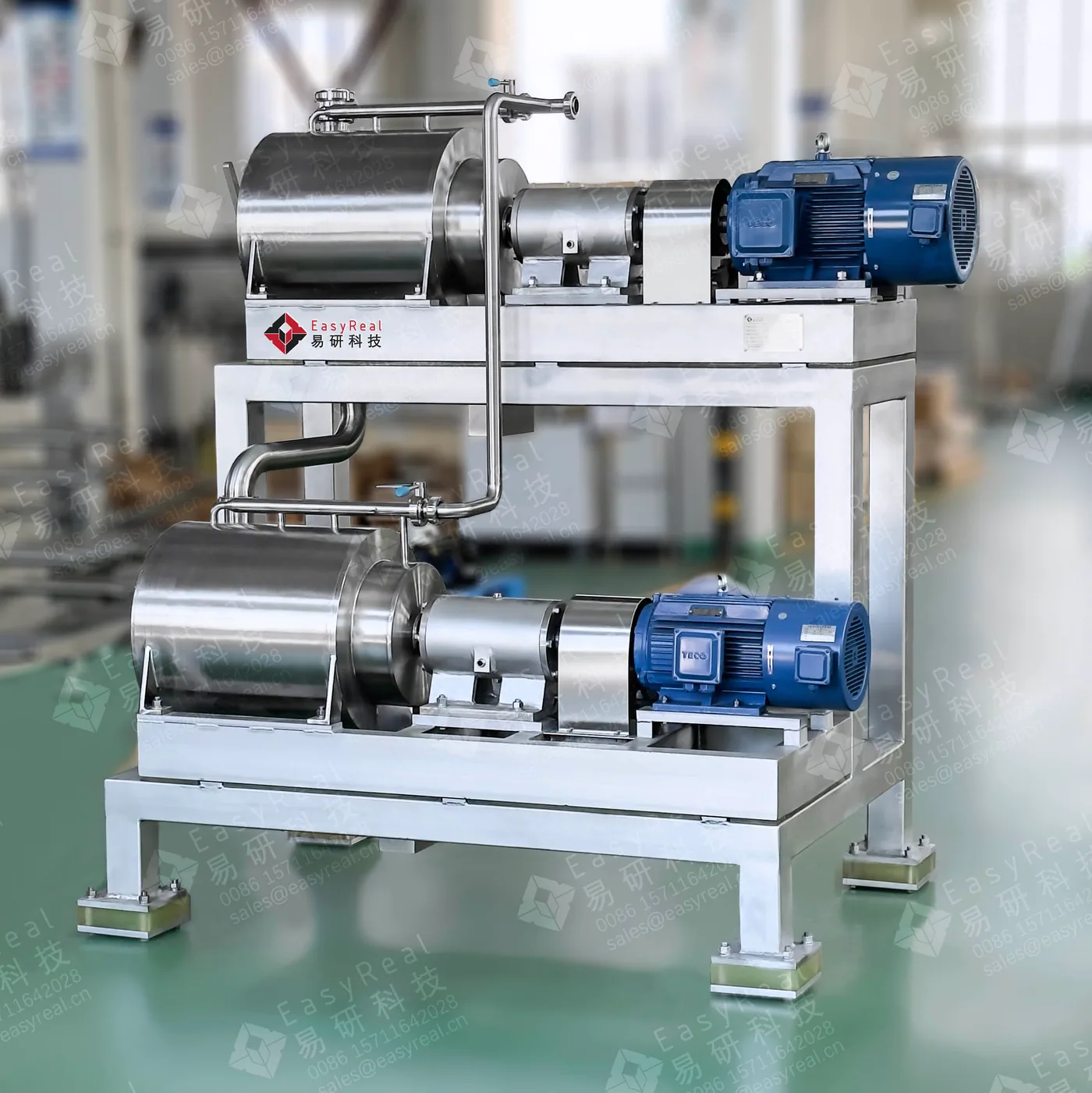 Side view of a stainless steel two-stage pulping machine